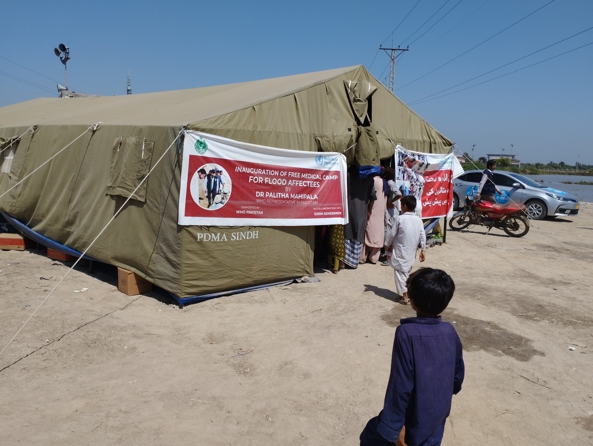 WHO delegation field visit to Larkana Internally Displaced Person (IDP) clinic .   A delegation from World Health Organization (WHO) led by Dr Mike Ryan, Executive Director, WHO Health Emergencies Programme along with WHO Representative in Pakistan, Dr Palitha Mahipala and WHO/EMRO Emergency Director, Dr Richard Brennan visited Pakistan and met with partners and the government to assess the needs and how best WHO can respond.   WHO is supporting the Government of Pakistan to respond by delivering supplies needed by health facilities and increasing disease monitoring to prevent the spread of infectious diseases. Devastating flash floods have washed away roads, homes and crops in Pakistan. The flooding was brought on by monsoon rains which began in mid-July 2022. The catastrophic floods killed over 1,400 people, destroyed more than half a million homes and displaced over 660,000 people into camps. Many more people are displaced in host communities. More than 750,000 livestock – a critical source of income for many families – died after the rainfall, which in August was more than five times the national 30-year average in some parts of Pakistan.  According to the Food and Agriculture Organization, the floods damaged 1.2 million hectares of agricultural land in Sindh Province alone. Some 33 million people have been affected, and access to many vulnerable communities was cut off as hundreds of bridges and thousands of kilometers of roads were destroyed or washed away.  https://www.who.int/news/item/17-09-2022-who-director-general-s-statement-on-pakistan--17-september-2022 - Title of WHO staff and officials reflects their respective position at the time the photo was taken.